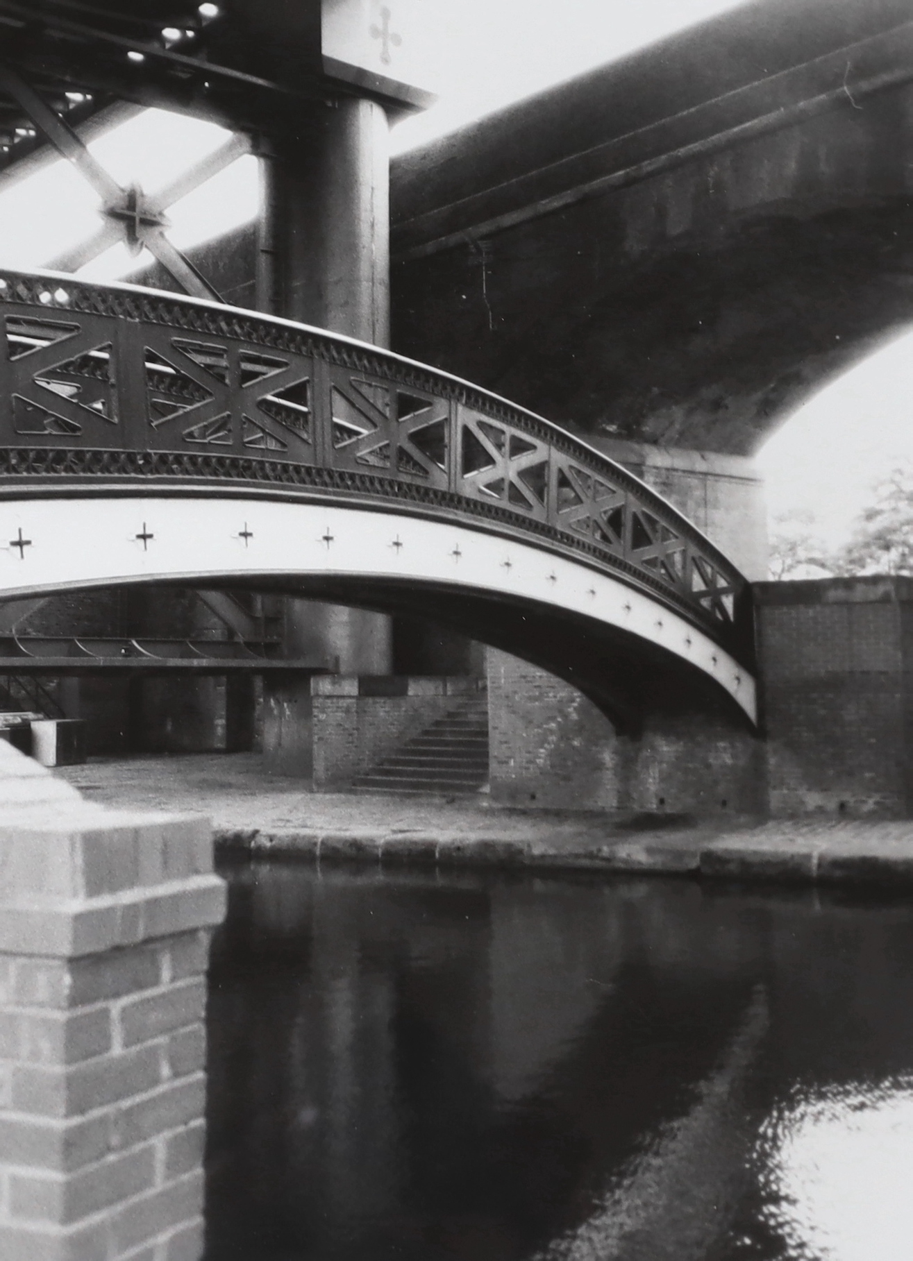 Two monochrome photographs, Manchester bridge views, 40 x 30cm